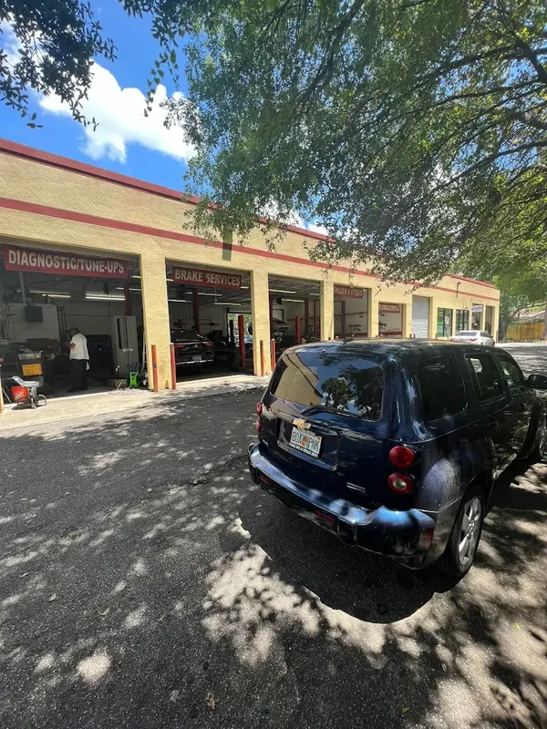 The AutoPlus shop exterior on West Commercial Blvd in Lauderhill